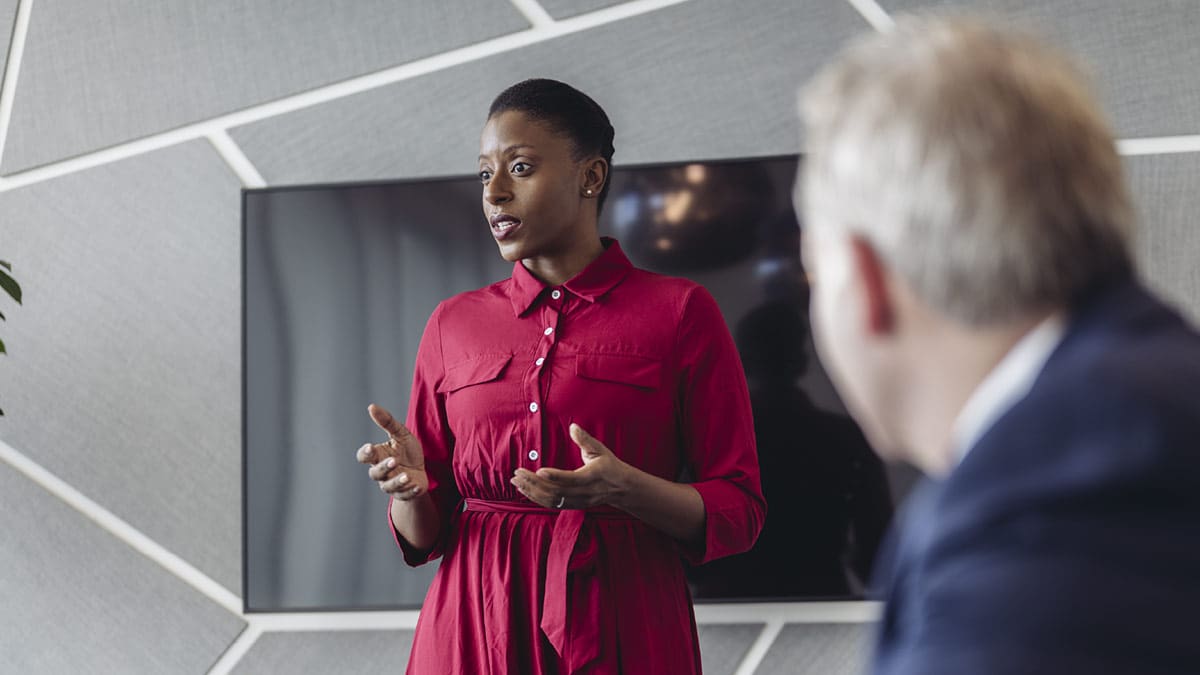 A Black woman leads a presentation.