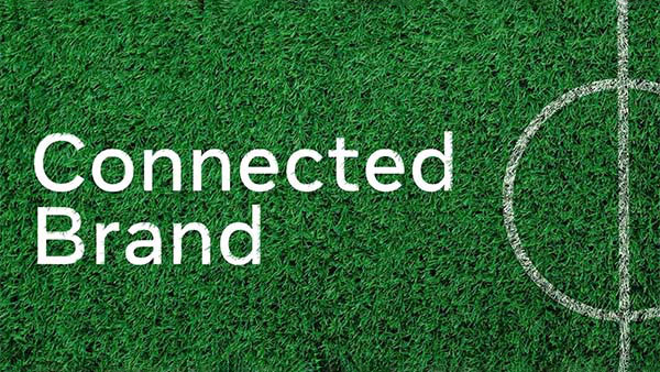 Green turf, with the text "Connected Brand".