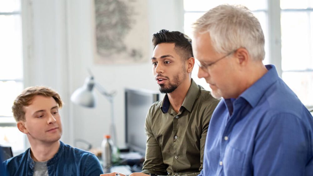 A group of employees collaborating during a communication training.