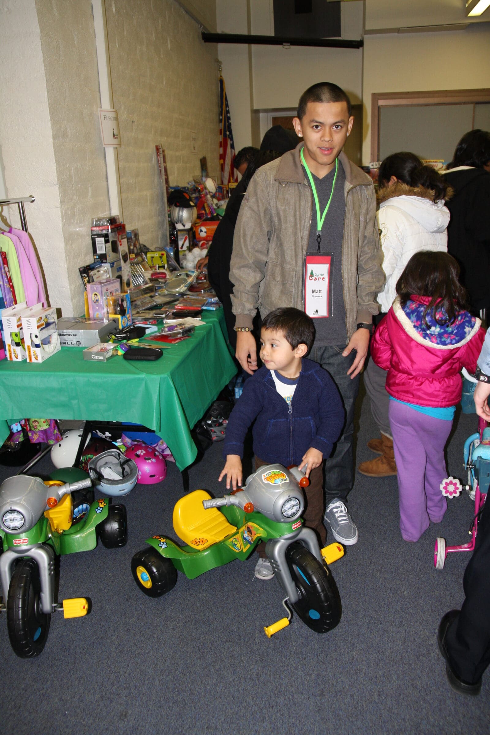 Children choosing toys from the donation pile