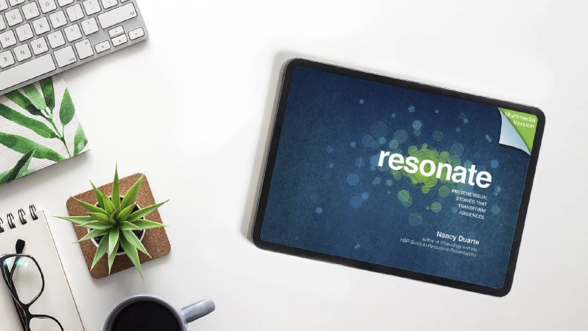 A tablet shows "Resonate" by Nancy Duarte.